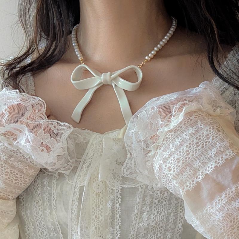 Thumbnail of Bowtie Maniac Large Ribbon Bowtie Round Freshwater Pearl Necklaces Porcelain White Gold image