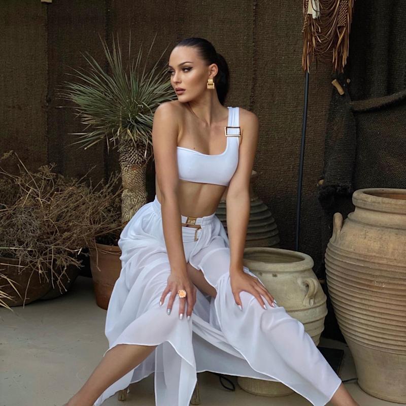 Thumbnail of Dulcet Double Layered One-Shoulder Bikini Top With Golden Buckle In White image