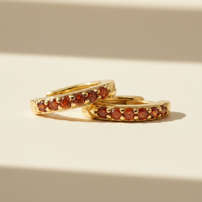 Thumbnail of Garnet January Birthstone Small Huggie Gold Plated Hoop Earrings image