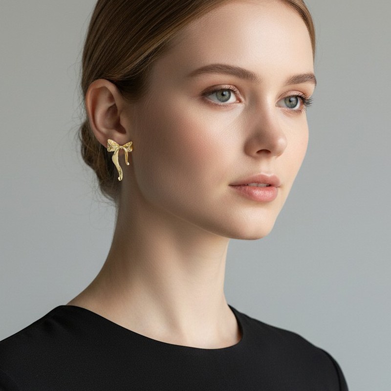 Thumbnail of Gold Bow Drop Stud Earrings image