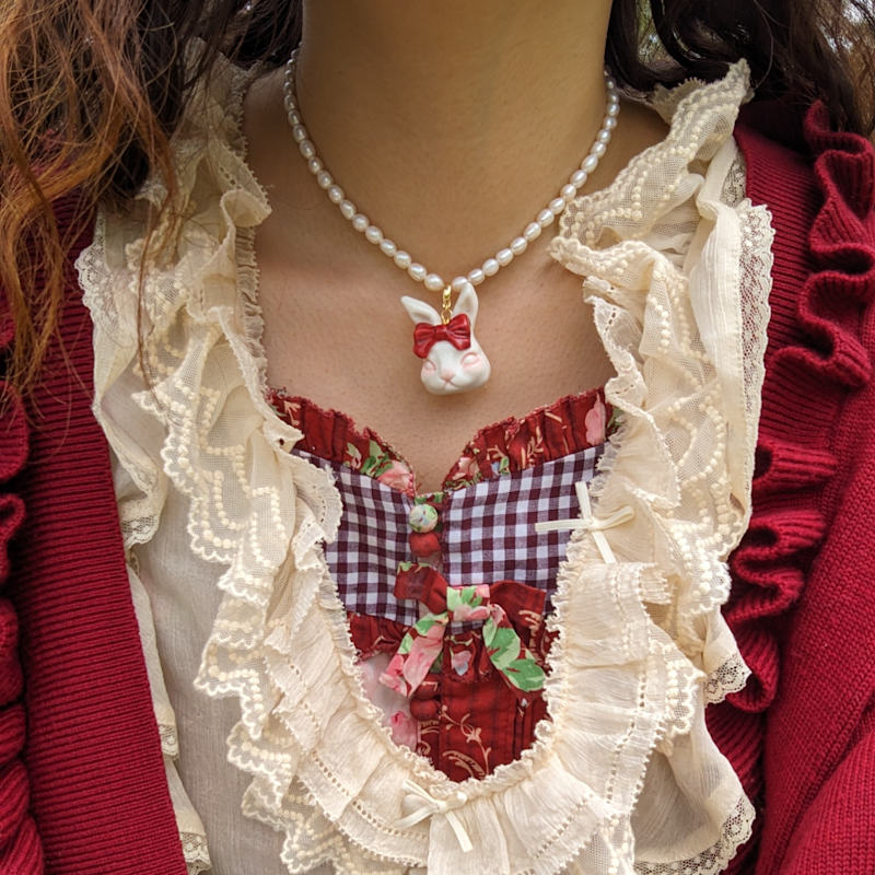 Thumbnail of Grumpy Bunny Ruby Red Bow Tie Freshwater Pearl Necklace image