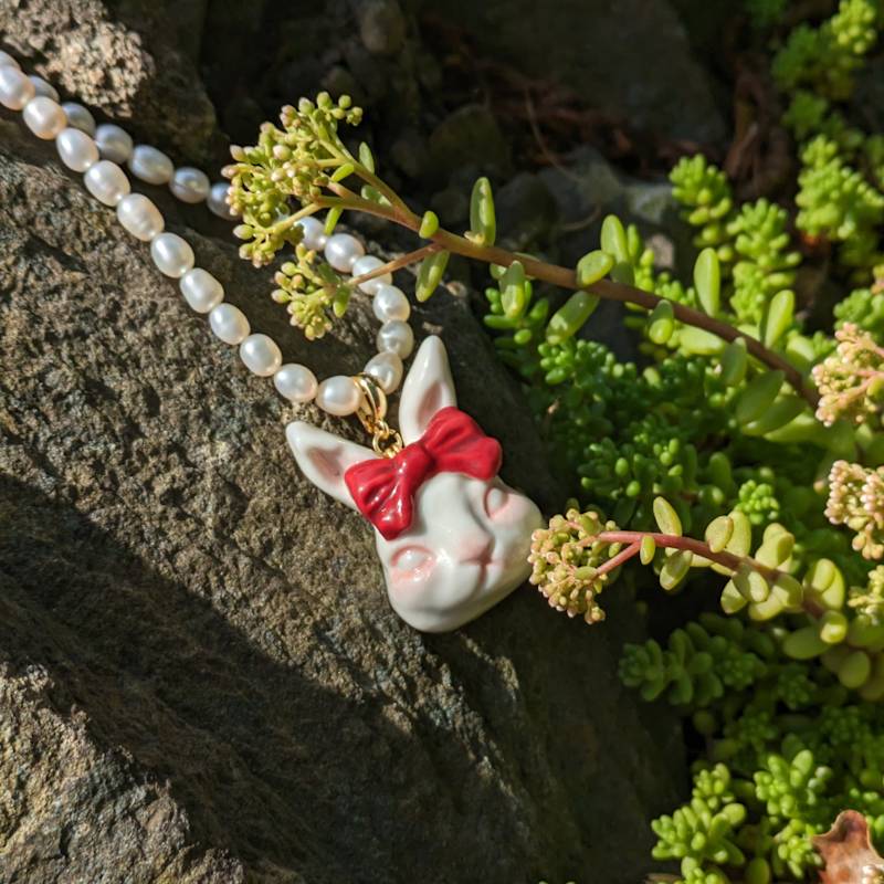 Thumbnail of Grumpy Bunny Ruby Red Bow Tie Freshwater Pearl Necklace image