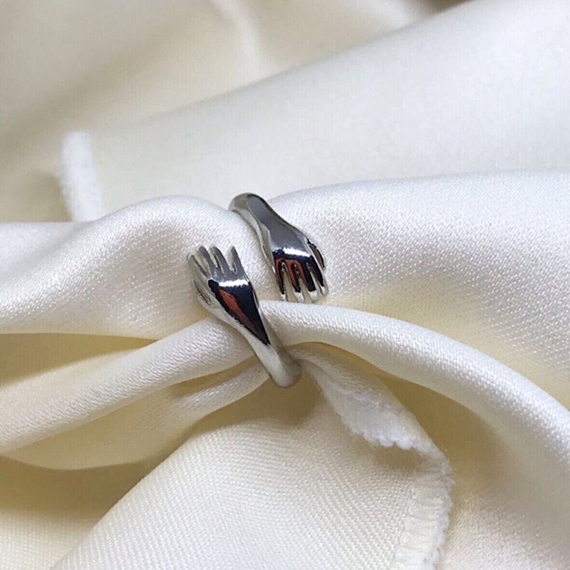 Thumbnail of Hug Ring With Hands Sterling Silver  - Silver image