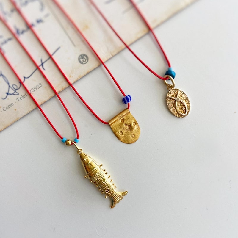 Thumbnail of Red String Necklace With Gold Charm image