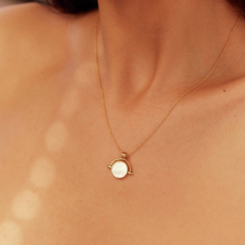 of pearl gold spinning disc necklace