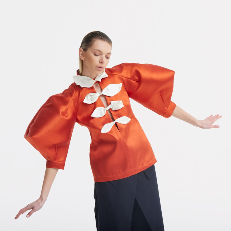 Thumbnail of Taffeta Deep V-Neck Blouse With Satin Floral Detail – Terracotta image