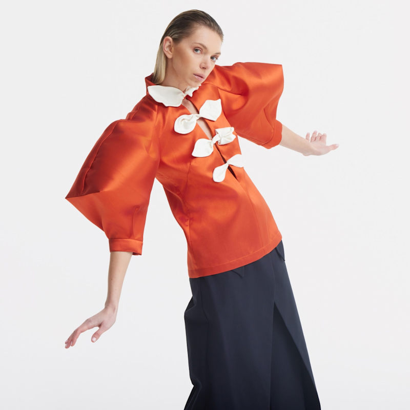 Thumbnail of Taffeta Deep V-Neck Blouse With Satin Floral Detail – Terracotta image