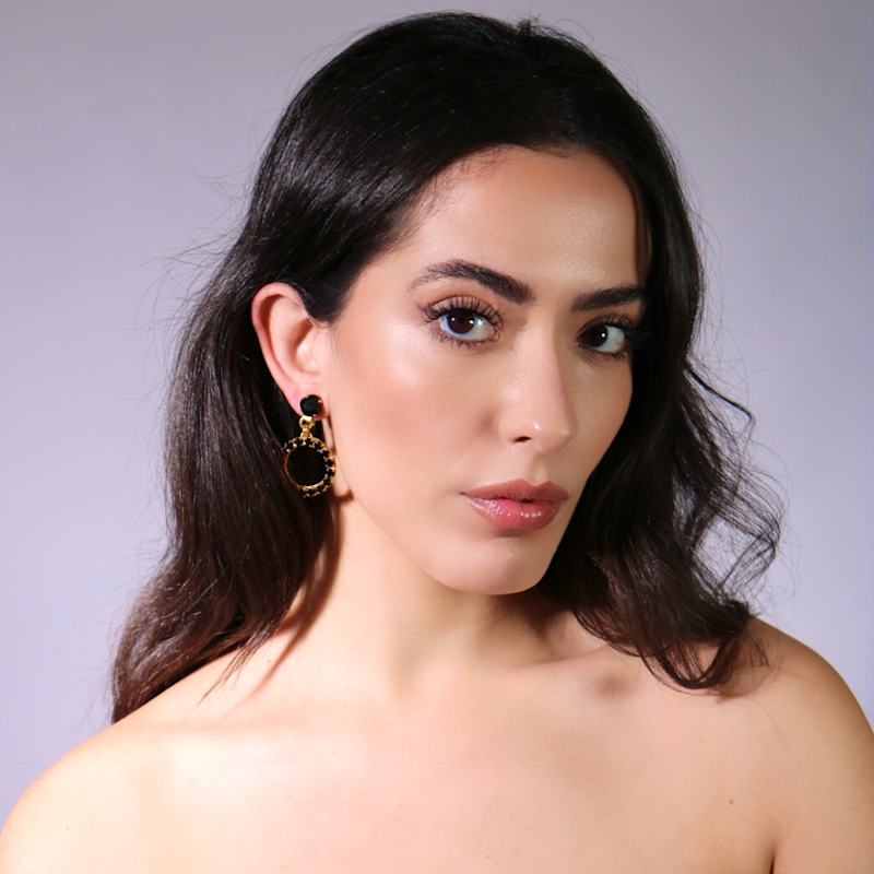 Thumbnail of The Small Black Hoop Earrings In Gold - Clip image