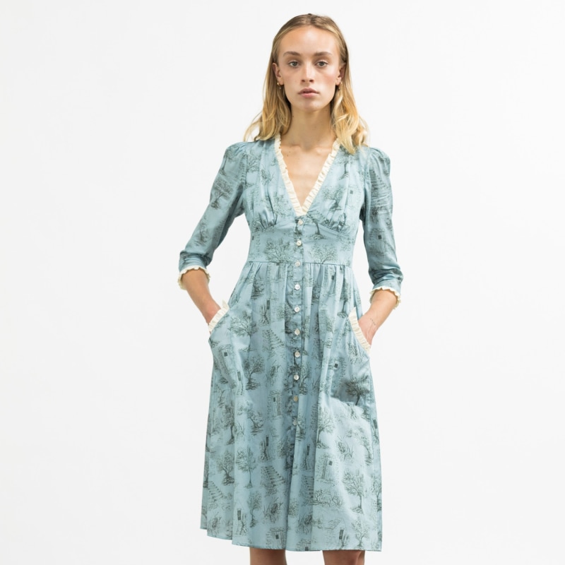 Thumbnail of Antonia Dress In Cottage Blue + Pewter Green Toile Cotton With Milk White Ruffle And Shell Buttons image