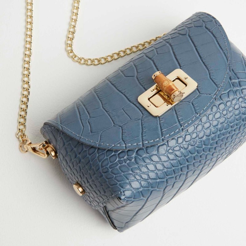 Thumbnail of Mini Luna Clutch Bag With Chain Strap In Denim Blue image