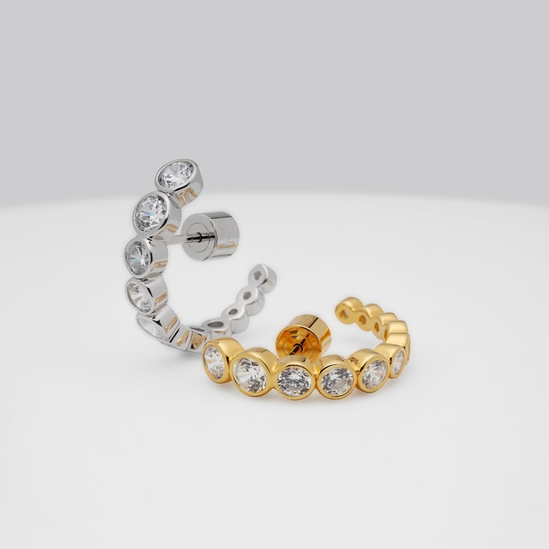 Thumbnail of Graduated Bezel Set CZ Huggie Earrings - Gold image