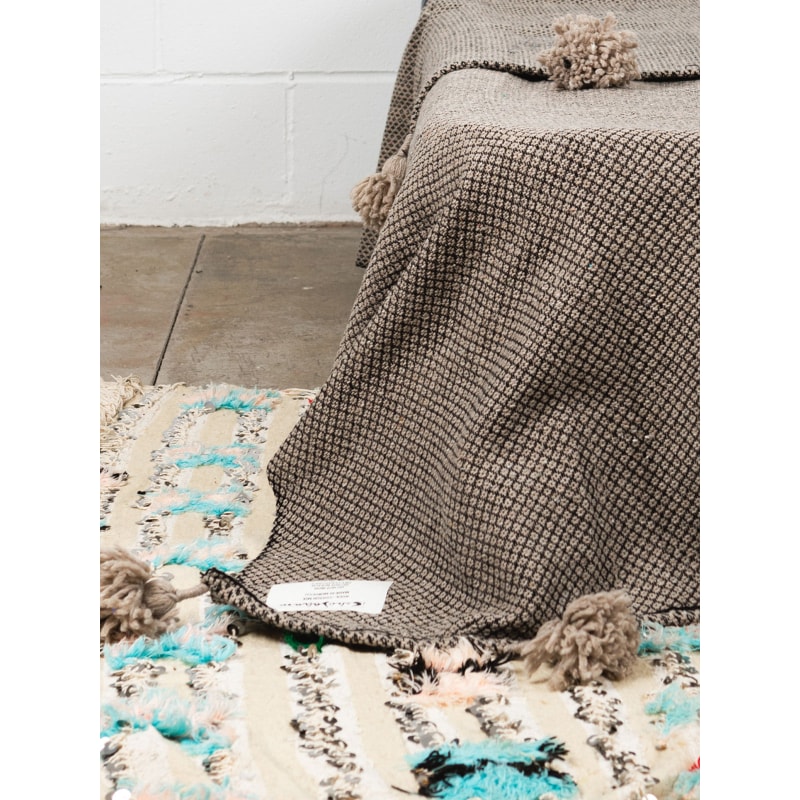 Beige pom pom throw top