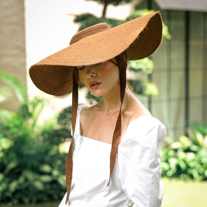 Thumbnail of Lola Wide Brim Jute Straw Hat In Havana Brown image