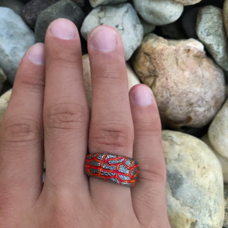 Thumbnail of Rivers Of Fire Black Rhodium Plated Sterling Silver Textured Red Orange Enamel Band Ring image