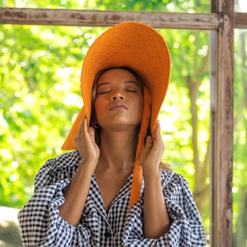 Thumbnail of Lola Wide Brim Jute Straw Hat In Orange image