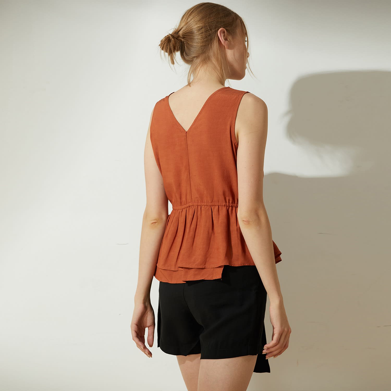 burnt orange peplum top