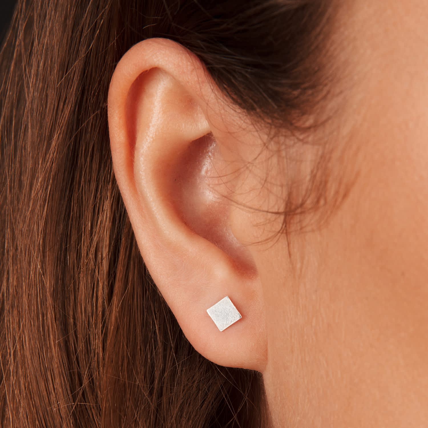 diamond stud earrings on ear