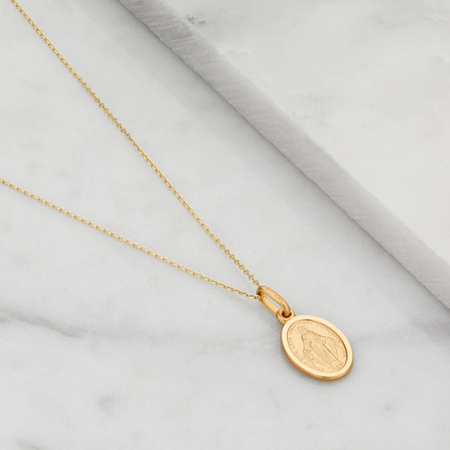 gold necklace with mama mary pendant