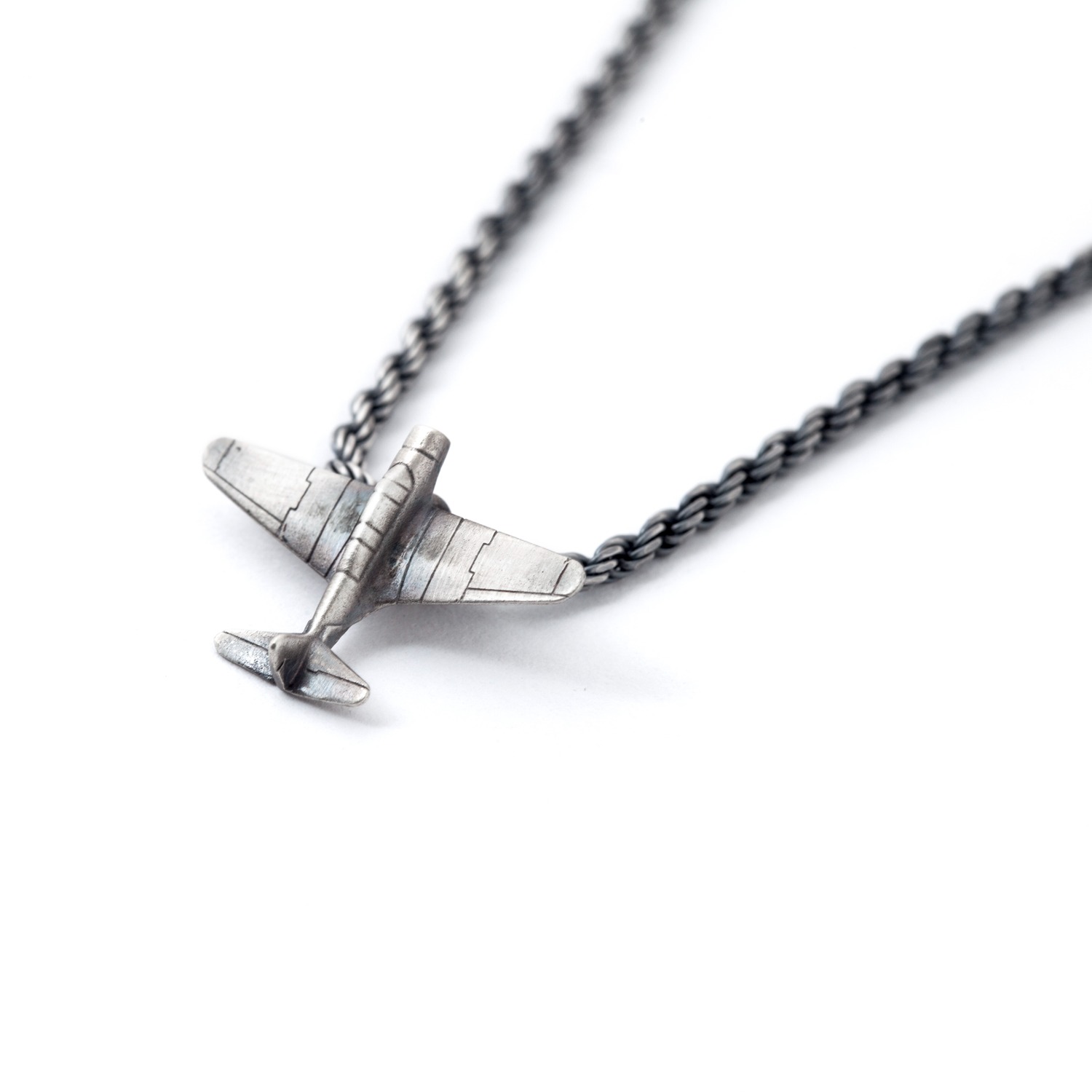 silver airplane necklace