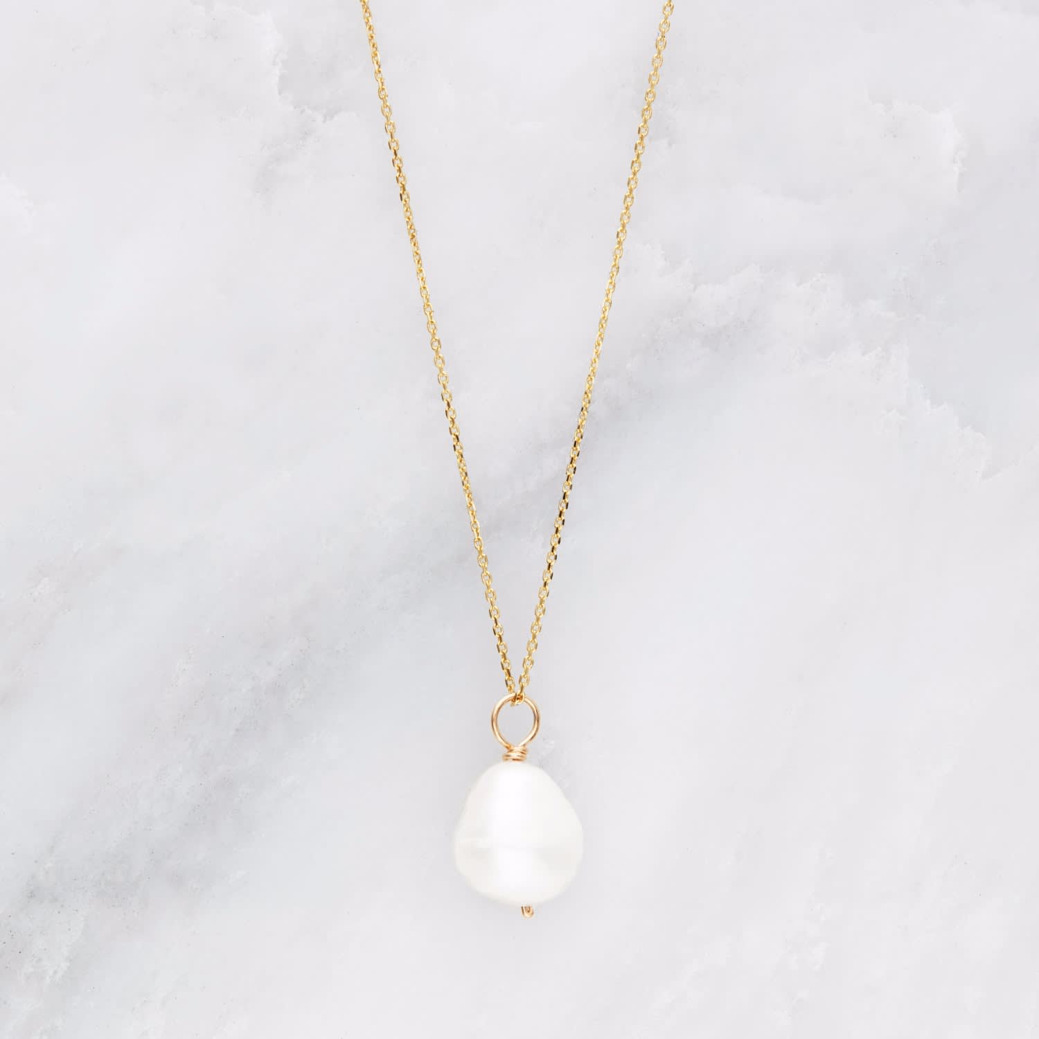 single pearl on gold chain