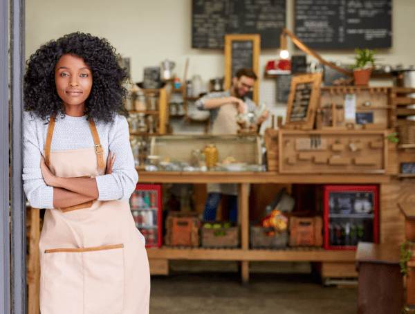 Hero image of a store owner processing a transaction