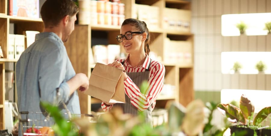 Photo of a worker helping a customer.