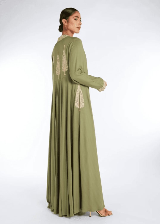 An olive green abaya with a tree on it