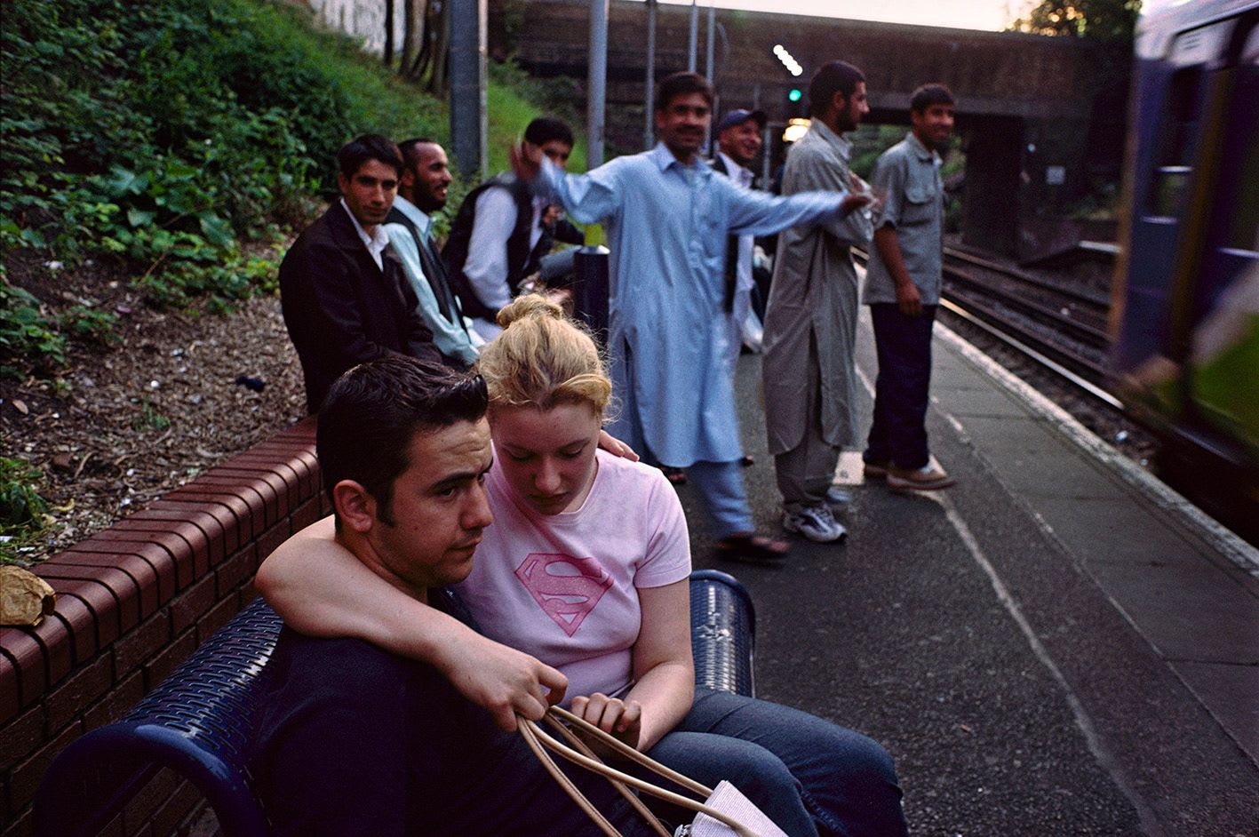 Image of teens on a train platform by Simon Wheatley