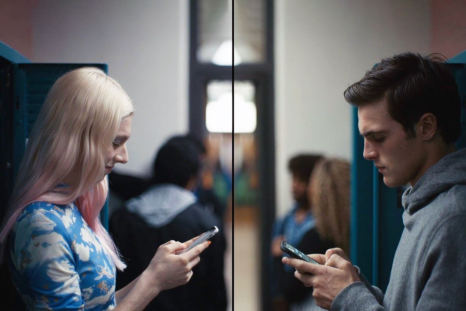 A man and woman looking at their phones