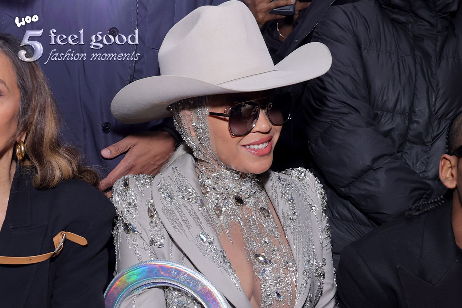 A woman in a cowboy hat and sunglasses