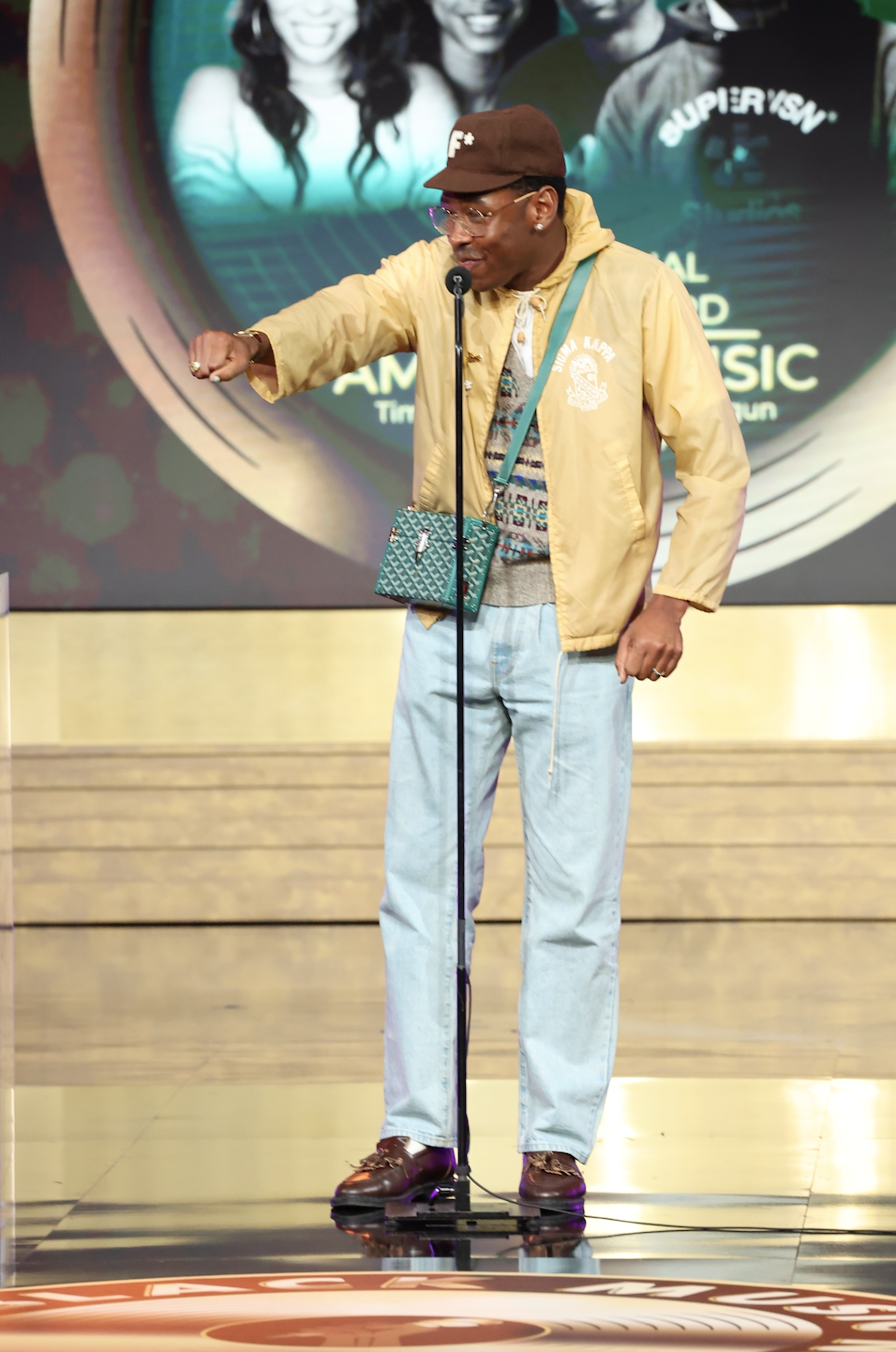 Tyler the Creator at the Grammys wearing Supreme Wool Overcoat, Louis  Vuitton Scarf & Converse Chuck Taylor All Star