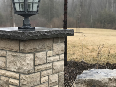 Natural stone wet-lay pillar. Wiarton wall stone with Banas stone cap.