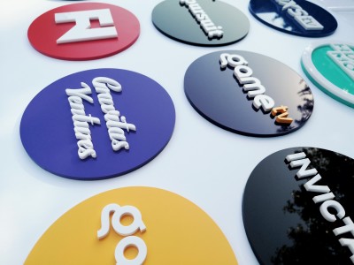 3 dimensional acrylic discs with raised logos, painted in Pantone matched colours. Toronto, ON.
