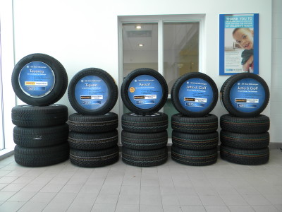 VW dealer tire marketing signs, Mississauga, Ontario.