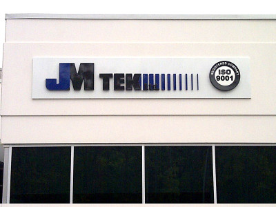 3 Dimensional Moulded plastic logo pin mounted to aluminum backing for factory in Oakville, Ontario