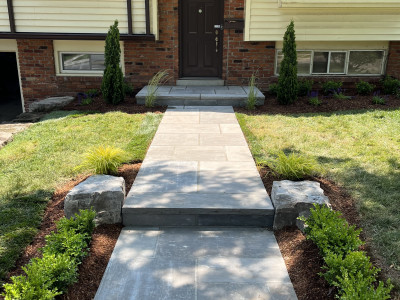 Banas natural stone walkway, armour stone, plants and mulch entrance