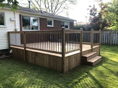 Standard deck design using brown pressure treated spruce lumber.