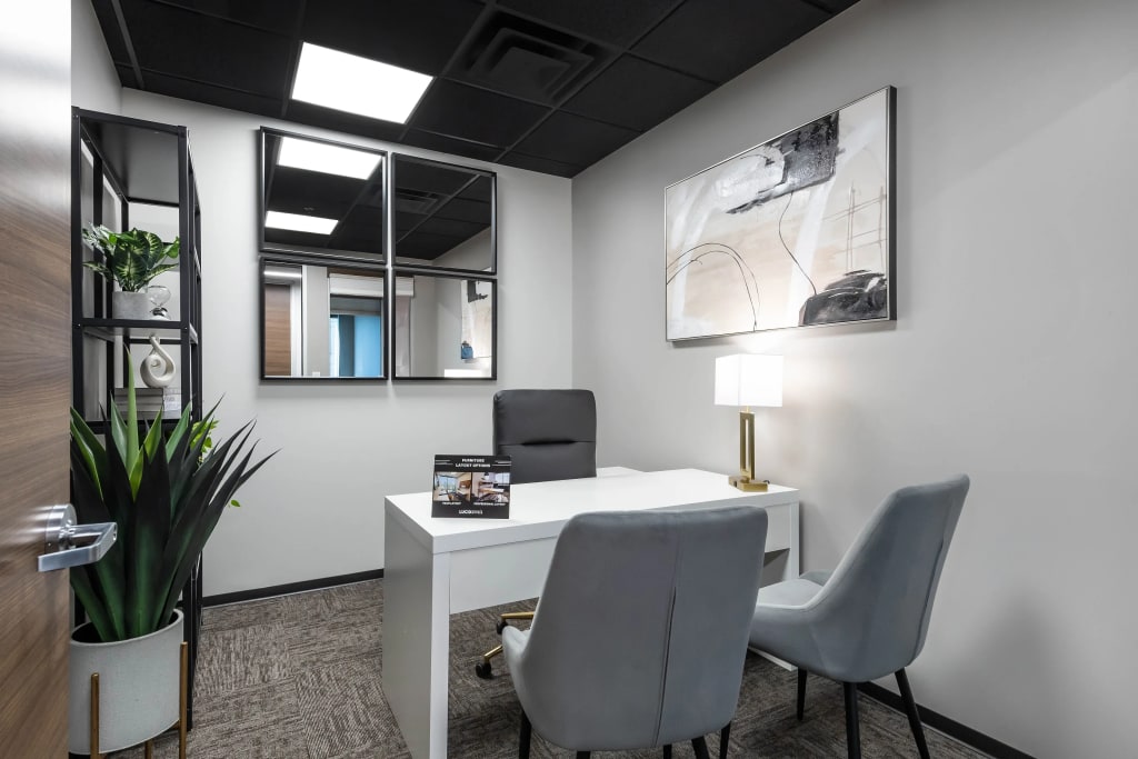 Team suite private office with multiple workstations and modern design