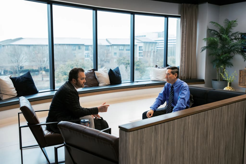 Private office meeting room at Lucid Private Offices with city views and modern wood desk