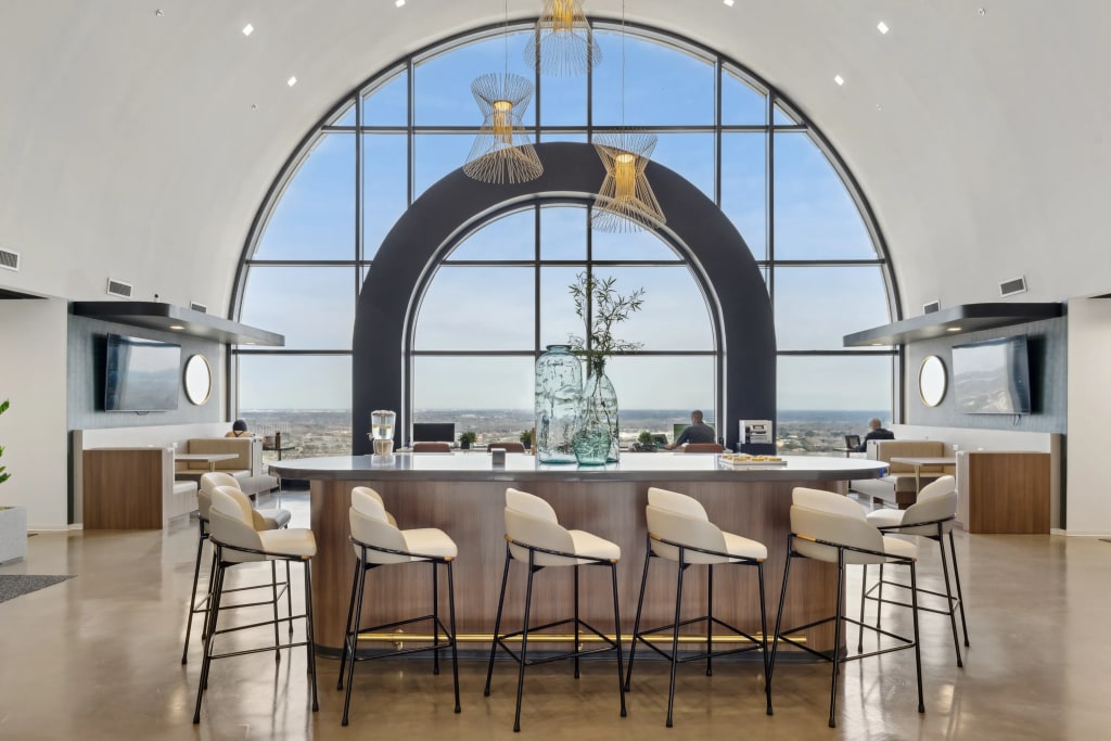 Coworking lounge and coffee bar with city views at Lucid Private Offices North Central Expressway