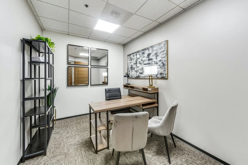 Private office at Lucid Private Offices Sugar Land with desk, bookshelf, and artwork
