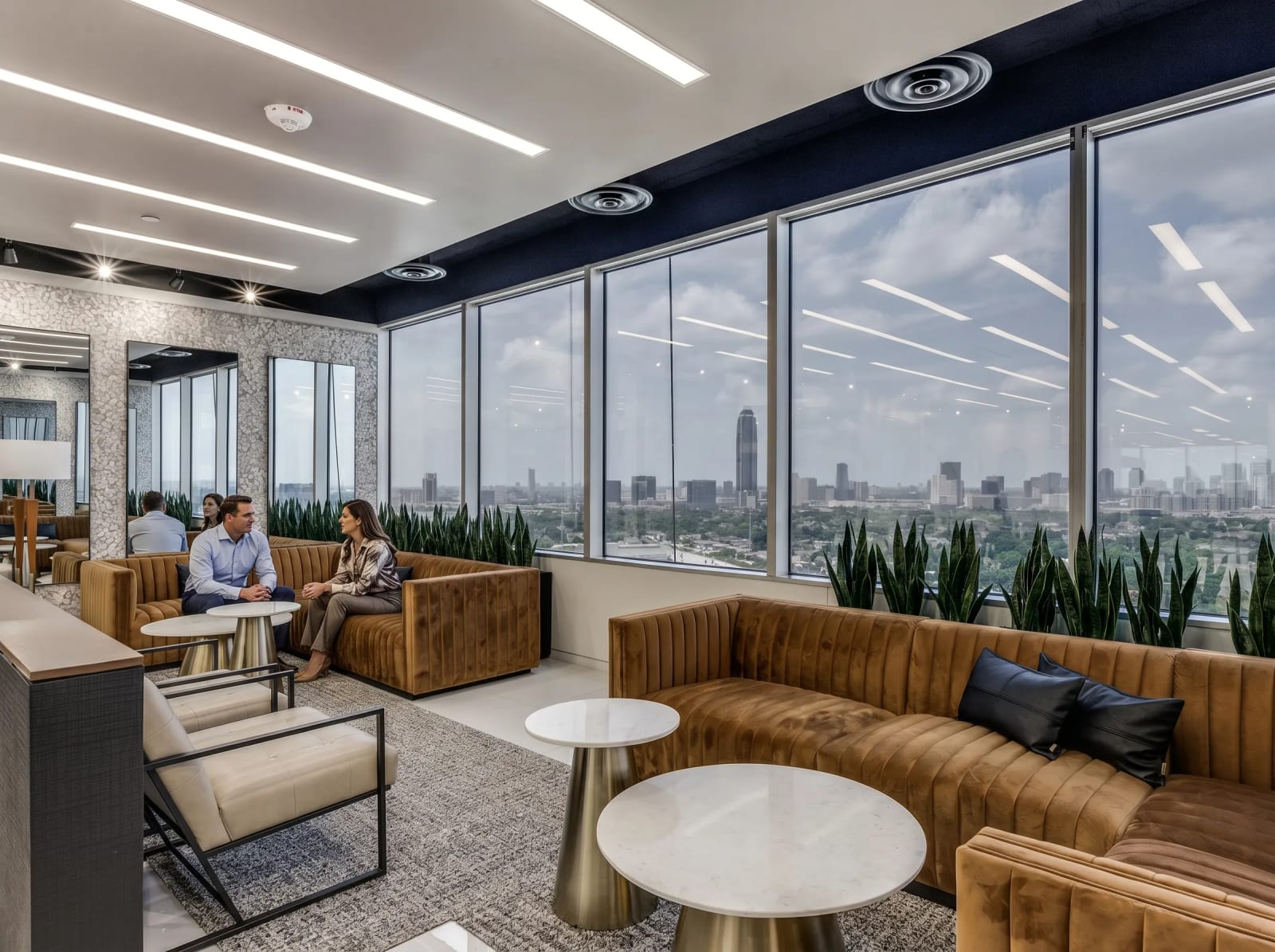 River Oaks coworking lounge area with comfortable seating and floor-to-ceiling windows