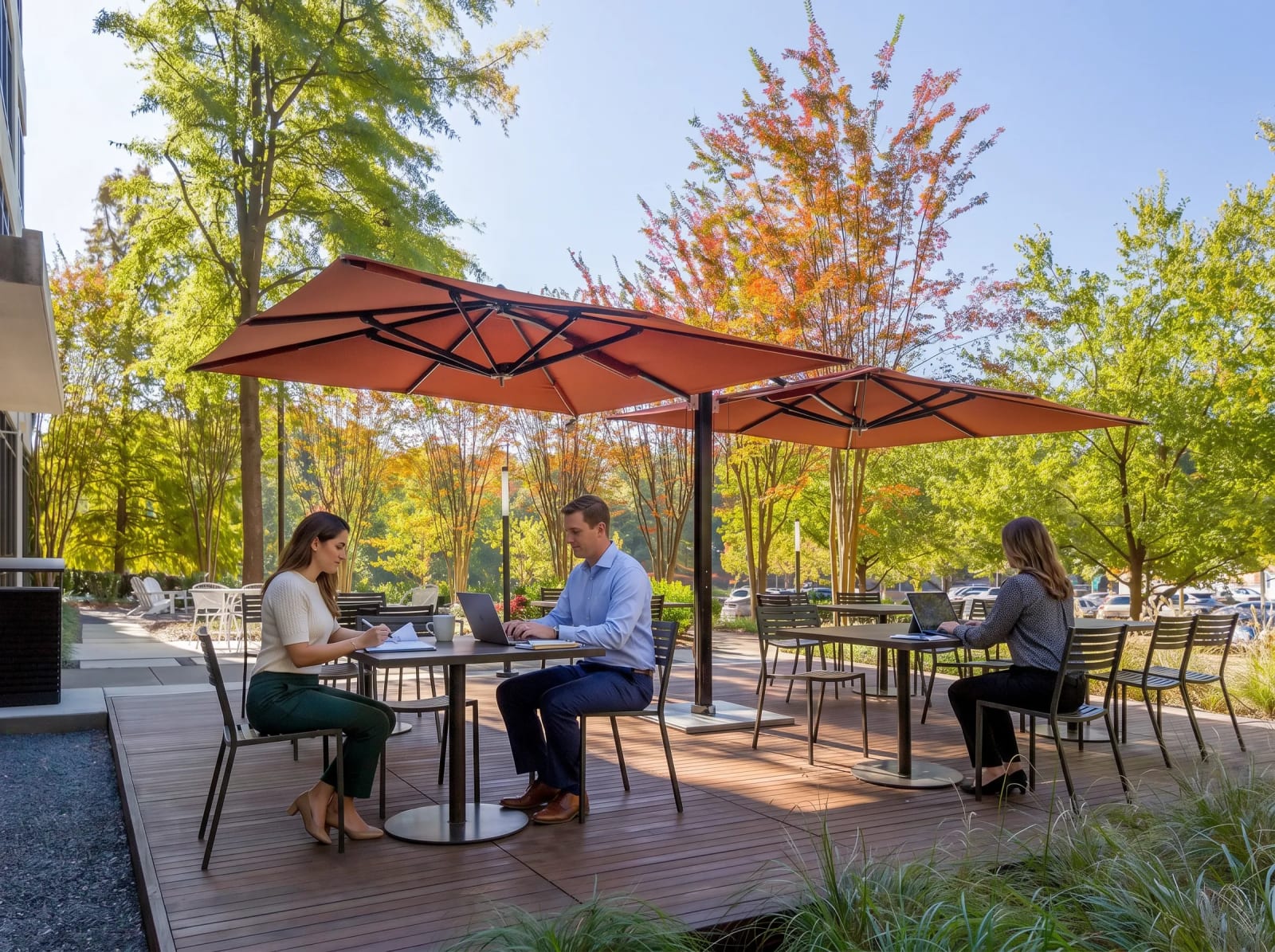 Lucid Private Offices Cumberland/Battery outdoor patio with shaded seating and workspace tables.