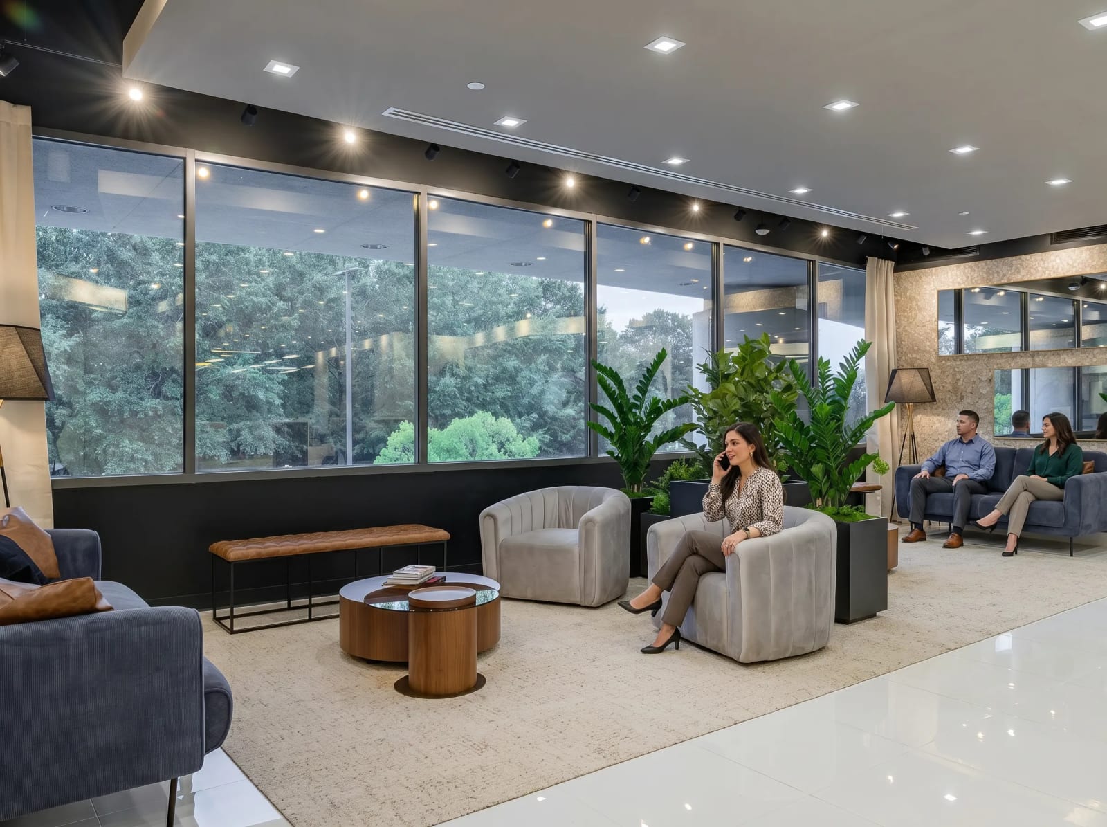 Lucid Private Offices Cumberland/Battery lounge with comfortable seating, natural light, and views of surrounding greenery.
