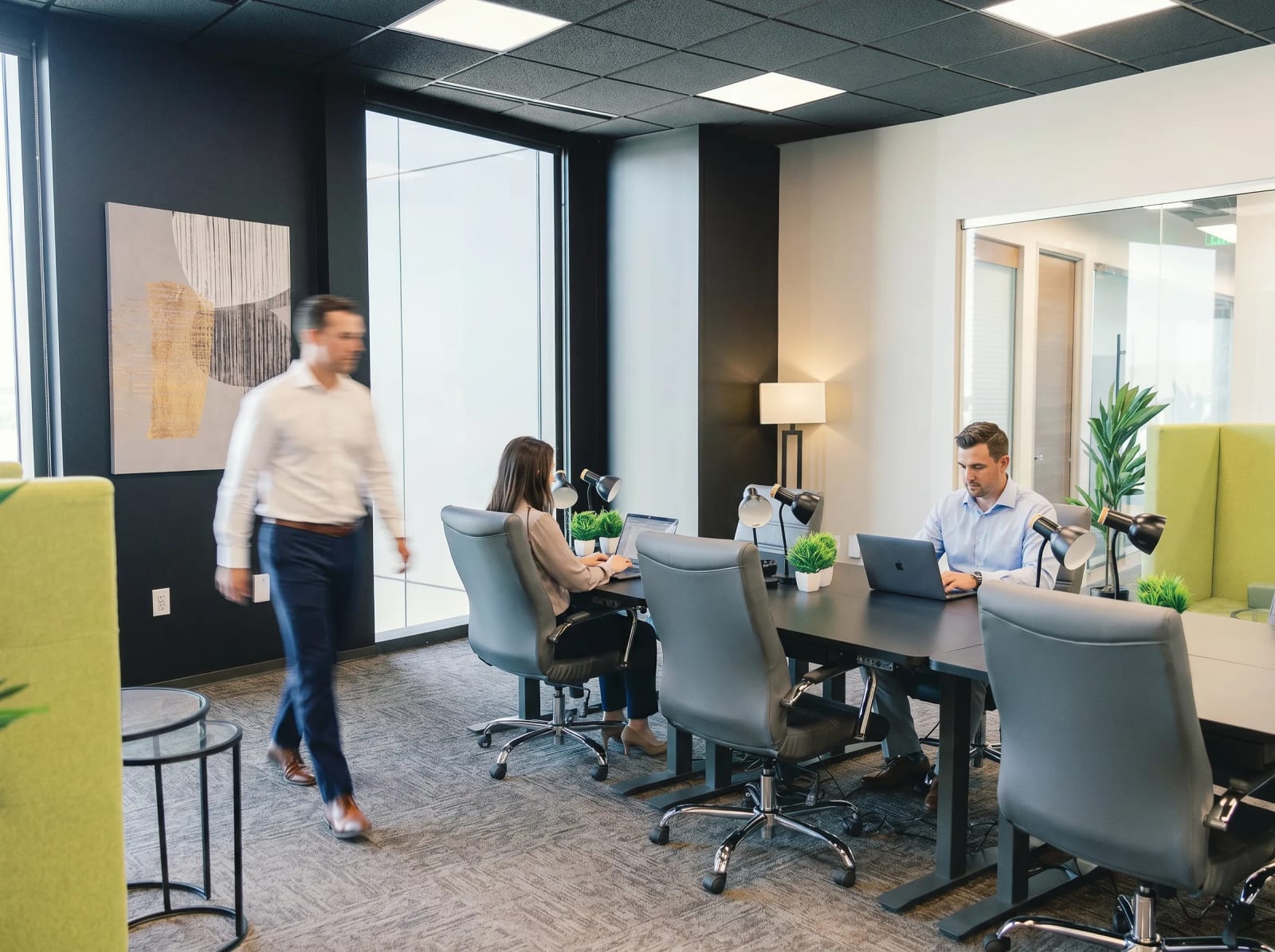 Professionals working in a team office at Lucid Private Offices