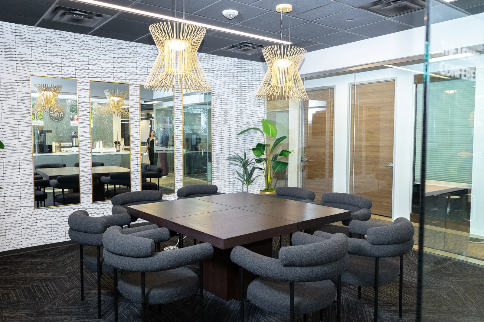 Elegant meeting room with pendant lighting at Lucid Private Offices Las Colinas