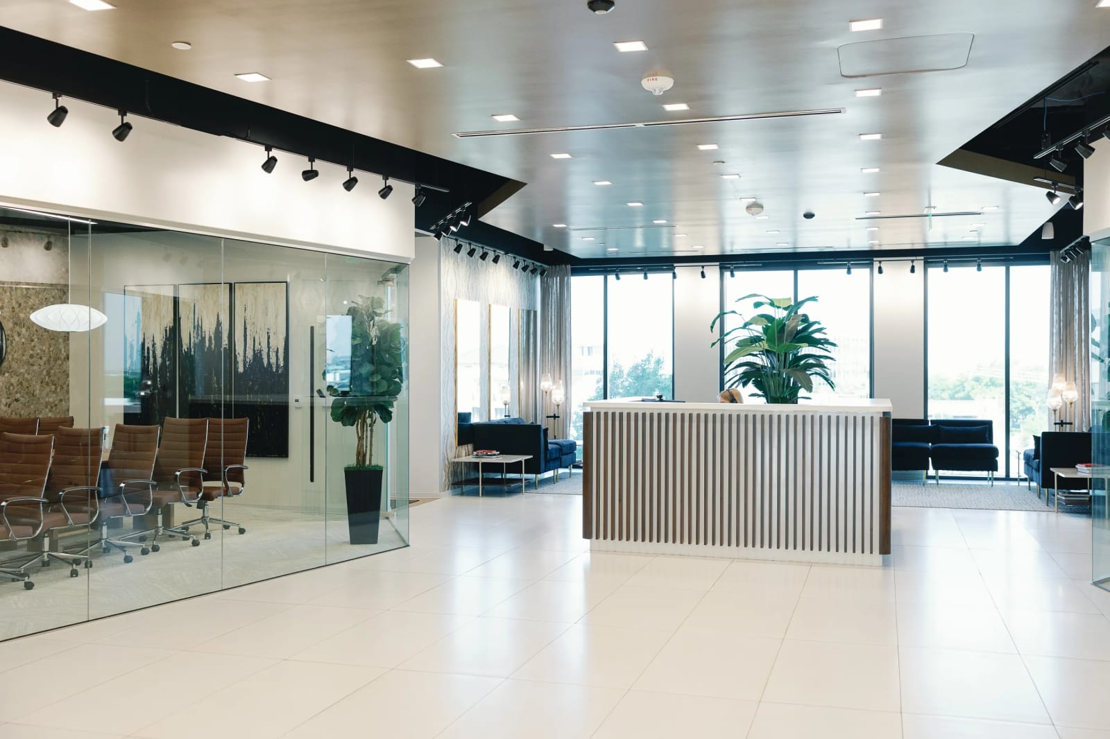 Lucid Private Offices McKinney reception lobby with marble floors, reception desk, and glass walls