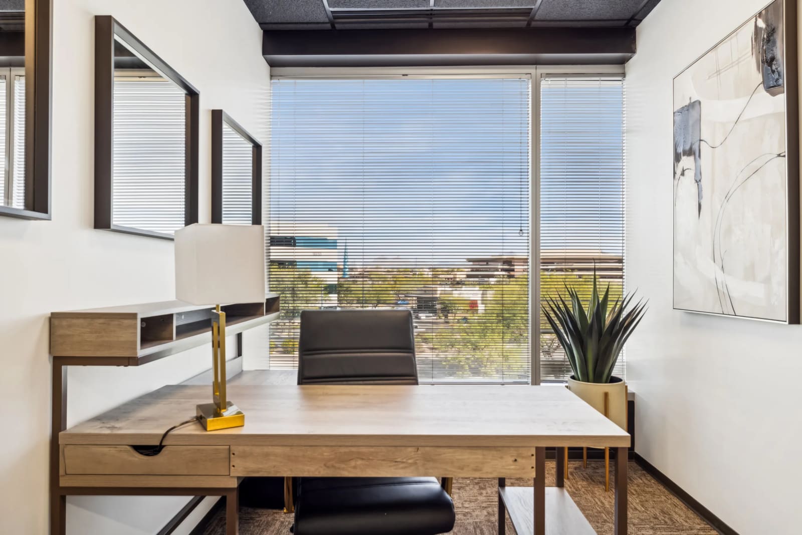 Bright private office at Lucid Private Offices Kierland with panoramic windows, modern desk, and upscale furnishings