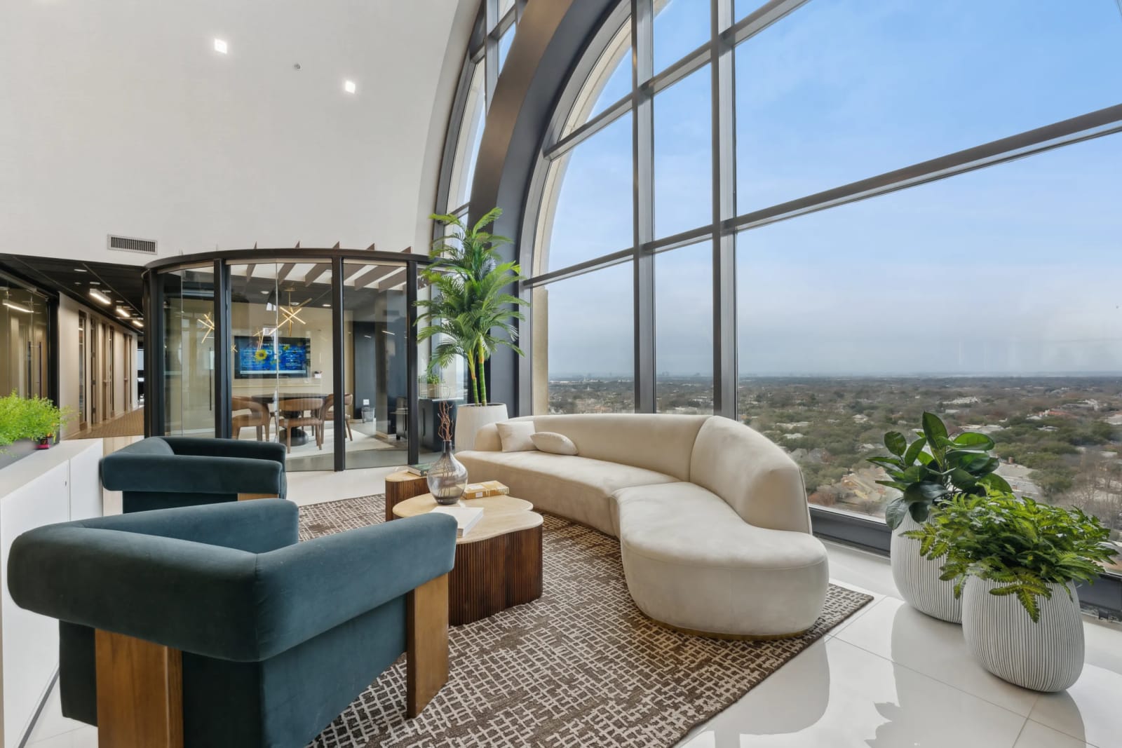 Coworking lobby with arched window and reception desk at Lucid Private Offices North Central Expressway