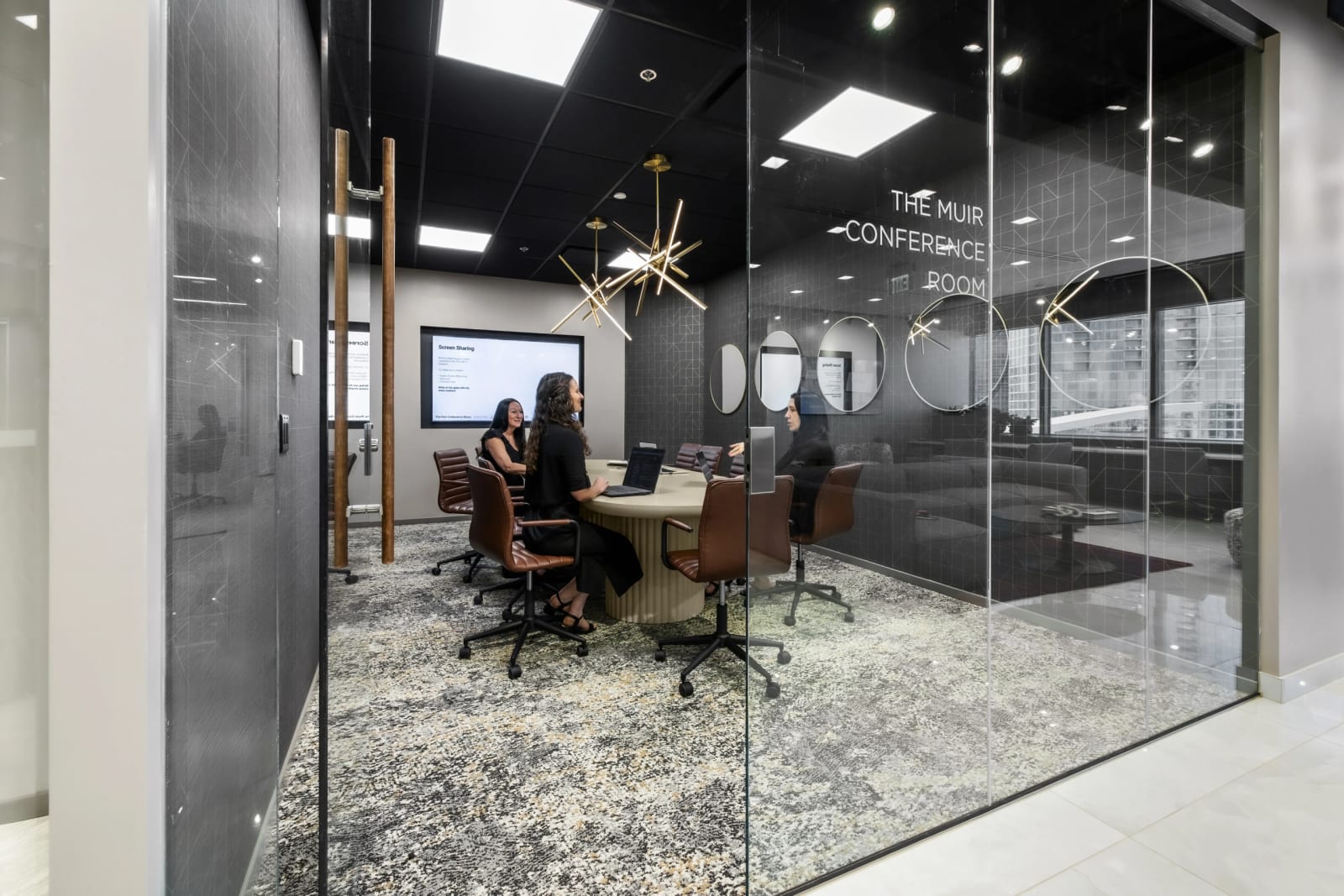 Conference room at Lucid Private Offices Midtown / Music Row with glass walls and collaborative meeting space.